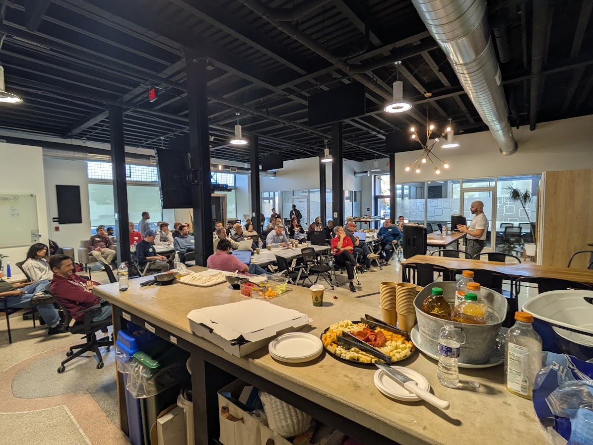 Panoramic view of AI Day event with Jamison presenting